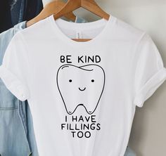 a t - shirt that says, be kind i have fillings too