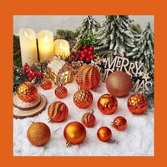 an assortment of christmas ornaments and candles in the snow