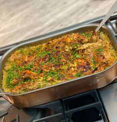 a casserole dish is being cooked on the stove