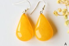 The earrings of Baltic amber in antique color will not betray your expectations. Executed in the shape of a drop, they will perfectly match to any outfit. It is a genuine, natural and unique piece of jewellery created by nature, so you will feel special on every occasion. Delight yourself or your loved one with a little miracle from nature.  EARRINGS A Earrings length with clasp: 4.6 cm. / 1.81 in Weight: 7.6 g. / 0.26 oz Color: antique, egg yolk, butterscotch Natural Baltic amber 925 sterling s Classic Yellow Teardrop Earrings, Yellow Baltic Amber Teardrop Jewelry, Amber Teardrop Earrings Gift, Amber Teardrop Earrings As A Gift, Amber Teardrop Drop Earrings For Gift, Elegant Yellow Baltic Amber Earrings, Yellow Baltic Amber Earrings, Amber Teardrop Baltic Amber Earrings, Teardrop Baltic Amber Earrings In Amber