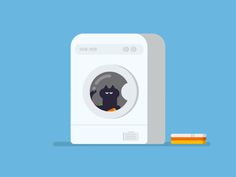 a washing machine with a black cat in the front and an orange on the side