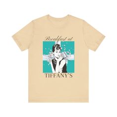 Breakfast at Tiffany's T & Co Brunch T-Shirt, Classic Audrey Crew, Girls Brunching Weekend Tee, Women's Shirt, Mimosa And Champagne Gifts ETHICAL MANUFACTURING AND ENVIRONMENTALLY FRIENDLY 1. 100% No Sweatshops & Eco-Friendly 2. All dyes are environmentally friendly and Bella & Canvas uses 7X less water than the average clothing manufacturer 3. Bella & Canvas are members of and exceed the standards set out by the Fair Labor Association (FLA) and Worldwide Responsible Accredited Production (WRAP) Summer T-shirt With Screen Print For Brunch, Spring Brunch Graphic Print T-shirt, Spring Graphic Print T-shirt For Brunch, Short Sleeve Screen Print T-shirt For Brunch, Short Sleeve T-shirt With Screen Print For Brunch, Graphic Tee With Screen Print For Brunch, Trendy Relaxed Fit T-shirt For Brunch, Tiffany T, Champagne Gift