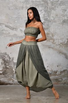 Embrace the spirit of bohemian wanderlust with our GAIA Shalvar Boho Pants, a versatile and essential addition to your wardrobe. These pants are the epitome of boho style and comfort, designed to meet the demands of the modern-day free spirit in every aspect. Crafted from soft and breathable fabric, they provide a luxurious and gentle embrace against your skin, ensuring you feel at ease from sunrise to sunset.The loose-fitting design of these pants offers unparalleled freedom of movement, allowi Bohemian Harem Pants For Vacation, Bohemian Wide Leg Pants With Elastic Waistband, Bohemian Wide Leg Trousers With Elastic Waistband, Bohemian Loose Harem Pants With Wide Leg, Bohemian Loose Fit Wide Leg Harem Pants, Bohemian Harem Pants With Wide Legs, Bohemian Harem Pants With Loosely Fitted Hips, Bohemian Wide-leg Harem Pants With Elastic Waistband, Bohemian Harem Pants For Yoga