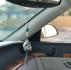 the interior of a car is decorated with bead and tassels, including beads