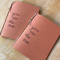 two cards with the words you are the one written on them, tied to twine