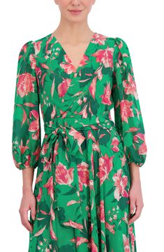 Bold blooms lend a hint of romance to this balloon-sleeve midi dress rendered in a playful faux-wrap silhouette and hugged by a tie belt. 37" front length; 57" back length (size 8) Back zip closure Surplice V-neck Three-quarter sleeves Tie belt Partially lined 100% polyester Hand wash, dry flat Imported