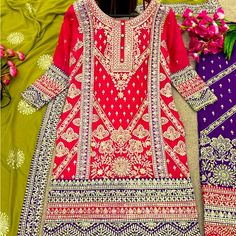 Heavy Embroidered Neon Pink Kurta Top. Dark Purple Embroidered Pants With Green Dupatta With Embroidered Purple Border And Motifs. New And Unworn Embroidered Purple Sharara, Purple Floral Embroidered Sharara For Eid, Purple Floral Embroidery Sharara For Eid, Purple Long Sleeve Sharara With Intricate Embroidery, Purple Embroidered Fabric For Eid, Festive Purple Embroidered Fabric With Dabka Work, Bollywood Style Purple Salwar Kameez With Floral Embroidery, Green Dupatta, Purple Border