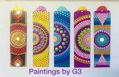 four painted bookmarks with different designs on them