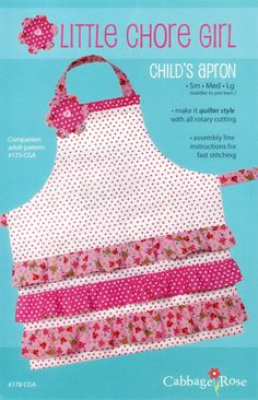 an apron made out of fabric with pink flowers and polka dots on the front, sitting against a blue background