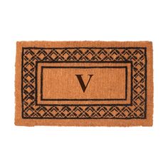 a door mat with the letter v on it and an ornate border in black ink