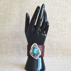 Original unique handmade bracelet. Each bracelet design is unique because of the sand-casting process, the embellishment and the color and design on the leather. Cuff is also leather lined for comfort. Native American Design, Leather Cuff Bracelet, Sand Casting, Bracelet Design, Leather Cuffs Bracelet, Kingman Turquoise, Leather Cuffs, Handmade Bracelet, American Design