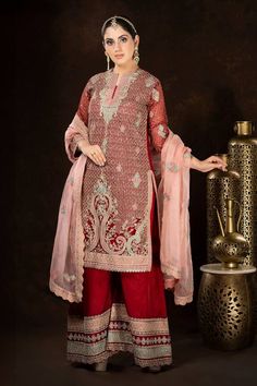 Red full sleeves A-line kurta with all over persian jaal embroidery using dori, thread and sequin highlights. Paired with a matching fleur embroidered palazzo and a contrasting baby pink scallop border fleur motif embroidered organza dupatta. - Aza Fashions Semi-stitched Dabka Saree For Reception, Elegant Red Salwar Kameez With Dabka, Semi-stitched Dabka Palazzo Set For Reception, Red Chinon Salwar Kameez With Dabka Detail, Red Chinon Salwar Kameez With Dabka, Red Dabka Lehenga For Reception, Red Unstitched Organza Anarkali Set, Red Unstitched Designer Wear Dupatta, Designer Red Unstitched Dupatta