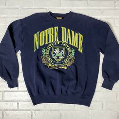 Vintage Notre Dame Fightin Irish Sweatshirt LG Navy Blue. Nutmeg Mills Size Large. Good condition. Small stain shown in last photo. Measures 23” pit to pit x 26.5” length. Theta Merch, Irish Sweatshirt, Notre Dame Sweatshirt, College Merch, 80s Tshirts, Vintage Notre Dame, Quote Sweater, Irish Sweater, Yellow Crewneck