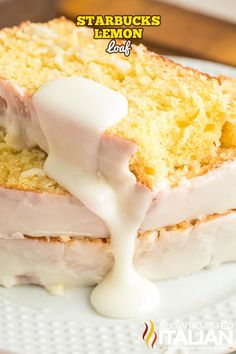 a white plate topped with slices of cake covered in icing