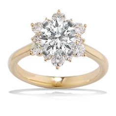 a yellow gold engagement ring with an oval diamond center