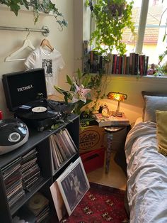 a bedroom with an old record player and various records