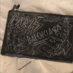 Balenciaga Graffiti Clutch Designer Black Pouch For Daily Use, Designer Black Pouch For Everyday, Designer Clutch Pouch For Shopping, Designer Black Leather Pouch, Designer Clutch Pouch, Designer Shopping Clutch Pouch, Designer Clutch Pouch For Everyday, Designer Pouch Clutch For Shopping, Designer Everyday Pouch Clutch