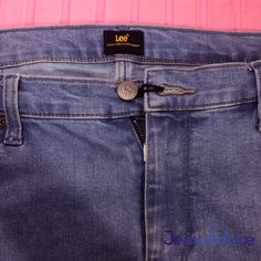 a pair of blue jeans with zippers on them