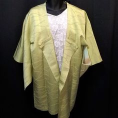 This listing is for a Japanique Jacket – slightly modified from a vintage kimono jacket (michiyuki) to create a roomier, casual fashion piece that suits sizes 10-16 very well. (See modification details below.)This Japanique Jacket is a springtime green - brighter than celery and with the faintest tint of chartreuse. The silk was woven with an arching hillside motif, and there's a shimmer to the silk that gives it a more formal or festive feel.There's a hidden pocket on the right side of the fron Vintage Kimono Jacket, Japanese Jacket, Male Kimono, Kimono Vintage, Casual Kimono, Vintage Japanese Kimono, Short Kimono, Womens Kimono, Vintage Kimono