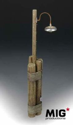 a wooden pole with a light attached to it