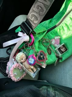 Baggu Keychain Aesthetic, Baggu Bag Accessories, Baggu Crescent Bag Decorated, Baggu Decorated, Baggu Charms, Keychains On Bag, Baggu Bag Aesthetic, Baggu Crescent Bag Aesthetic, Baggu Bag Outfit