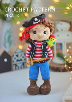 a crochet pirate doll is standing on a table