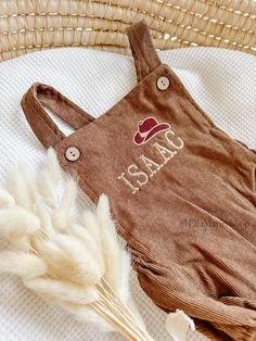 Saddle up for your little cowboy or cowgirl's first birthday with our charming romper overalls, perfect for a "Wild One", "How the West was One", or "My First Rodeo" themed celebration!  This adorable outfit is designed to add a touch of Western flair to their special day. Crafted with soft corduroy fabric, these overalls are both stylish and comfortable for your little one. The cowboy hat embroidery on the chest, accompanied by your little ones name, adds a playful and festive touch, perfect fo Wild One First Birthday Outfit, Cowboy Hat Embroidery, Embroidered Overalls, Romper Overalls, Outfit Cowboy, 1st Rodeo, Wild One First Birthday, Wild Birthday Party, My First Rodeo