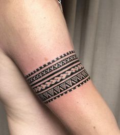 a woman's arm with a tattoo on it that has an intricate design in black and white