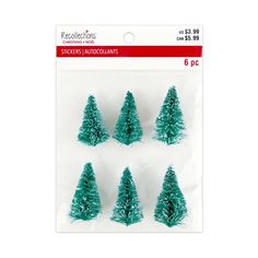 six small green christmas trees in plastic packaging