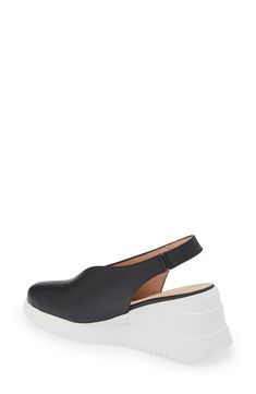 A deep V-cut silhouette defines the vamp of this almond-toe slingback set on a textured platform. 2 1/2" heel; 3/4" platform (Size 39) Leather upper and lining/synthetic sole Made in Spain Leather Slingback Wedge Sandals, Black Leather Slingback Pumps With Deep Heel Cup, Modern Platform Slingback Sandals For Formal Wear, Modern Platform Slingback Sandals For Formal Occasions, Modern Formal Platform Slingback Sandals, Evening Platform Slingback Sandals In Synthetic, Modern Slingback Sandals With Textured Sole For Spring, Chic Slingback Pumps With Wedge Heel In Synthetic, Leather Slip-on Platform Wedge Sandals