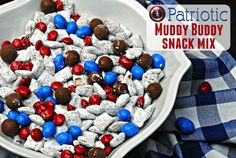 red, white and blue candies in a bowl on a checkered table cloth