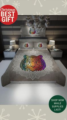 a bed with a colorful tiger on it and the words christmas best gift above it