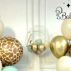 a giraffe balloon is in front of some balloons