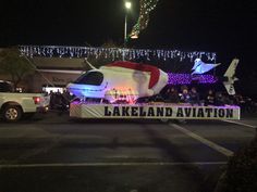 a parade float is decorated with lights and decorations