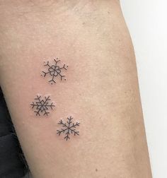 two small snowflakes on the arm