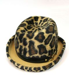 DESCRIPTION This is an absolutely fabulous vintage hat from the 70s made by Yves Saint Laurent in a hard to come by style.  The hat is made out of a velvety soft fur felt that has a leopard print design done in dark brown, black, and light brown.  The hat has an upturned bumper brim that also has a leopard print on it.  There is a black leather hat band with a gold tone metal accent on one side.      SIZING The hat does not have a size tag, but I believe it would best fit a size Medium.  I perso Vintage Fur Felt Fedora, Vintage Fur Felt Fedora For Fall, Retro Winter Fedora With Curved Brim, Retro Flat Brim Fedora For Winter, Vintage Flat Brim Fedora For Winter, Vintage Hat Bands For Fall, Retro Winter Fedora With Flat Brim, Vintage Winter Fedora With Flat Brim, Vintage Fedora With Flat Brim For Winter