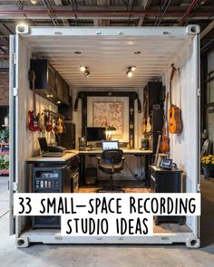 the inside of a shipping container with an office area and desk in it, surrounded by guitars