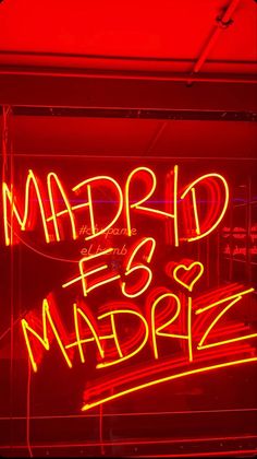 a red neon sign that says madrid ess madriz