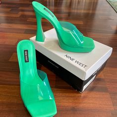 Pair These Slick Nine West Slides With Jeans This Fall Trendy Green Slip-on Heels, Trendy Green Heels With Reinforced Heel, Trendy Green Heels With Heel Loop, Casual Green Heels With Reinforced Heel, Green Synthetic Heels With Heel Loop, Green Square Toe Heels, Green Square Toe Heels With Heel Loop, Green Slides, 5 Inch Heels