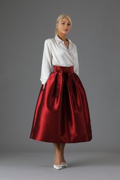 Satin Pleated Tiered Skirt, Elegant Voluminous Flared Wrap Skirt, Elegant Fitted Taffeta Skirt, Party Long Satin Pleated Skirt, Elegant Taffeta Gathered Skirt, Elegant Pleated Tiered Wrap Skirt, Elegant Taffeta Skirt With Gathered Details, Satin Tiered Skirt With Lining, Elegant Satin Skirt With Ruffles