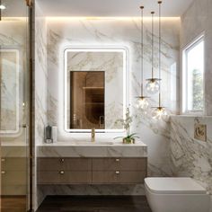 a modern bathroom with marble walls and flooring