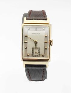 1950's Hamilton 14K Solid Gold "Keith Model" Men Wristwatch, Just Serviced, Runs Normal and Keeps Accurate Time. This watch measured 22.00 mm width without crown, 38.00 mm from lug to lug and it's in excellent working condition. Original curved thick acrylic lens with no scratches on surface. Original champagne color dial with no scratches; movement serial number is M157637, Grade 982 Manual Wind 19 Jewels by Hamilton USA Watch Co. Lancaster, Pa. USA.14k solid yellow gold case, no dings or dents with minor wear and scratches. This watch recently has been serviced and runs normal keeps accurate time. The genuine leather watch band is dark brown and will fit to a 6 3/4 wrist comfortably. Please NOTE: the original minute hand has been replaced as shown. The pictures are part of my item descri Classic Collectible Watch With Rectangular Dial, Classic Watches With Rectangular Dial For Collectors, Classic Collectible Watches With Diamond Hour Markers, Vintage Rectangular Diamond Watch With Diamond Hour Markers, Retro Rectangular Watches For Formal Occasions, Retro Rectangular Formal Watches, Vintage Yellow Gold Watch With Rectangular Dial, Vintage Diamond Watch With Rectangular Dial, Vintage Rectangular Jewelry With Diamond Hour Markers