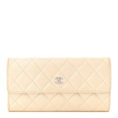 This is an authentic CHANEL Caviar Quilted Large Flap Wallet in Ivory. This chic wallet is crafted of diamond quilted luxurious caviar leather in off white. It featuresa front flap with a small polished silver Chanel CC logo. Thisopens with a snap to a matching leather and fabricinterior with a card slot panel, patch pockets and a coin compartment. Elegant Quilted Wallet For Formal Occasions, Elegant Quilted Wallets For Formal Occasions, Elegant Quilted Rectangular Wallet, Classic Quilted Rectangular Wallet, Classic Formal Quilted Wallet, Elegant Quilted Leather Wallet, Elegant Beige Evening Wallets, Elegant Beige Wallets For Evening, Elegant White Evening Wallet