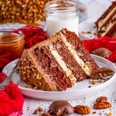 a slice of chocolate cake on a plate with pecans around it and a jar of milk in the background