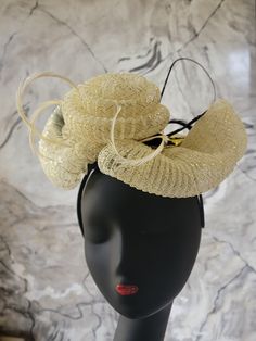 A cream and gold crinoline fascinator with biot feathers on an Alice band. Luxury Gold Fascinator With Structured Crown, Elegant Summer Fascinator With Feather Trim, Elegant Feathered Headpiece For Vintage Events, Chic Kentucky Derby Headband Fascinator, Elegant Evening Hair Accessories With Feather Trim, Elegant Gold Headpiece With Feathers, Chic Adjustable Fascinator For Party, Elegant Party Fascinator With Feather Trim, Elegant Party Headband With Feather Trim