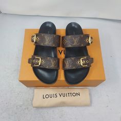 Louis Vuitton Brown Buckle Bom Dia Monogram Flat Slide Sandal Size Eu 37 Us 7 Womens Comes Box And Dustbag 100% Authentic *Price Is Firm* Color: Cacao Brown Classic Dark Brown Slip On Sandal With Allover Lv Monogram Print Patent Monogram Canvas Adjustable Strap Anatomic Insole Smooth Outsole Louis Vuitton-Engraved Buckle Please Note Signs Of Wear On Bottom As Shown. Luxury Brown Slides, Luxury Slides With Buckle Closure, Luxury Brown Slides With Round Toe, Luxury Brown Sandals With Round Toe, Louis Vuitton Slides, Louis Vuitton Brown, Lv Monogram, Monogram Prints, Louis Vuitton Shoes