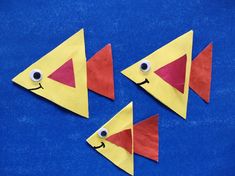 three pieces of paper that have been made to look like fish with googly eyes