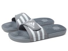 PRICES MAY VARY. Lightweight slides with soft cushioning Hook-and-loop closure for an adjustable fit Single-bandage EVA upper for lightweight comfort; EVA massage nubs on footbed Cloudfoam midsole and memory foam sockliner for step-in comfort and superior cushioning Unisex product is men's sizing. Women should size down 1 to 1.5 sizes Mens Shoes Sandals, Black And White Sneakers, Kids Luggage, Sport Sandals, Us Man, Mens Sportswear, Sneaker Collection, Pharmacy Gifts, White Sneakers