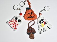 crocheted key chains with halloween decorations on them