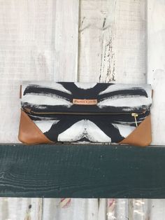 "NEW! The Vivian clutch from my Zydeco and Jazz collection made with linen cotton fabric from my textile line and 100% genuine leather.  Each clutch is unique and is hand cut and handmade for each customer. Fully lined and has brass zipper exposed. When unfolded, it measures 12\"x12\". Includes D rings for easy to attach gold chain which measures 47\" in length. Small variations in size and pattern repeat may occur. Each clutch/crossbody is custom made for each individual customer and is inspect Hand Painted Purses, Bridesmaid Clutch, Unique Clutch, Statement Clutch, Bridesmaid Clutches, Foldover Clutch, Leather Clutch Purse, White Clutch, Handmade Clutch